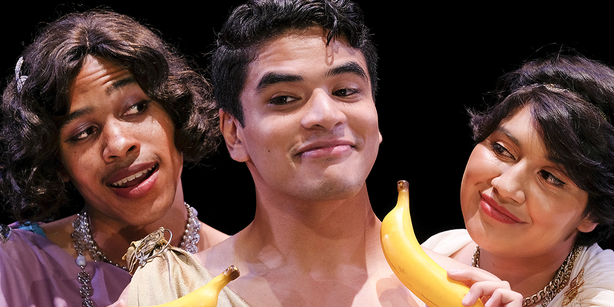 Photo of three Lysistrata characters and two bananas